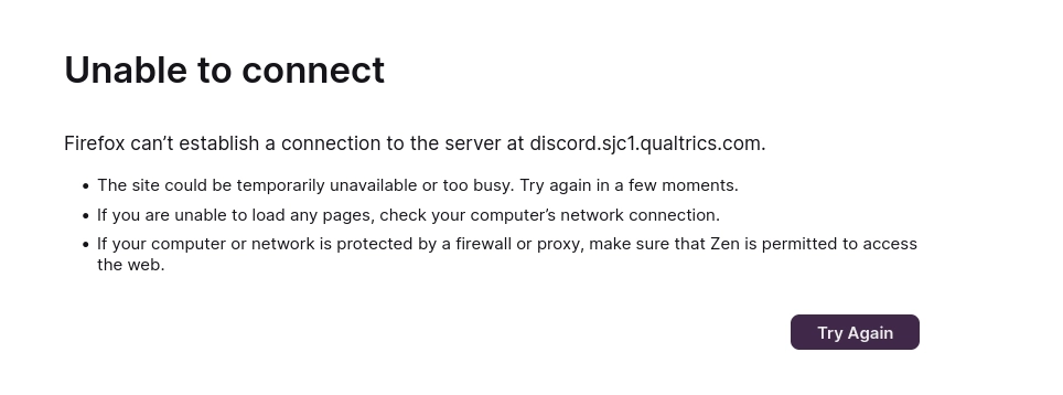 "Unable to connect." "Firefox can’t establish a connection to the server at discord.sjc1.qualtrics.com." Below the error, a bulleted list provides troubleshooting steps: checking the site's availability, verifying the computer's network connection, and ensuring firewall or proxy settings permit Zen to access the web. A dark purple "Try Again" button is located in the bottom right corner